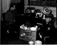 1950-1-26 Police looking over stolen goods by Ralph Kenny 1.jpeg