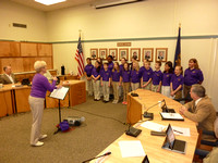 Students sing at school board