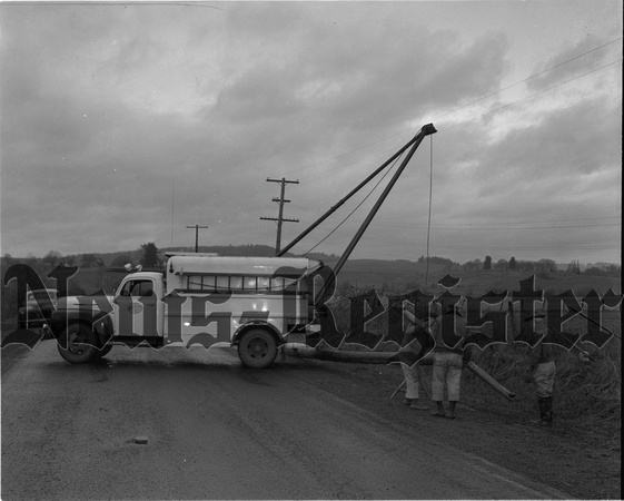 1950-2 Water & light setting up poles after winter storms.jpeg