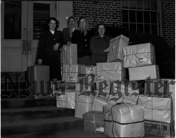 1947-12-18 M.H.S Girls League donate clothes to Alaskan kids.jpeg