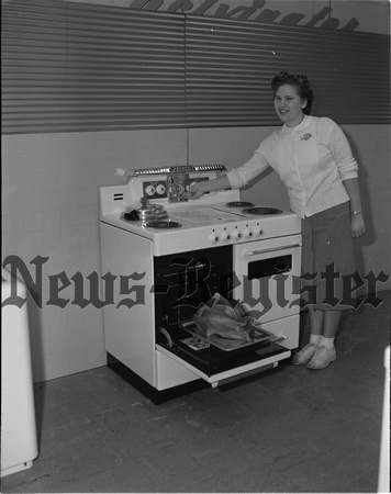 1949-12-8 Laune, Pat winner of electric stove from McMinnville Appliance.jpeg