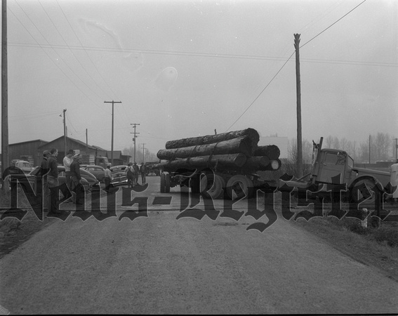 1955-3-25 Log truck Loses in Duel with train.jpeg
