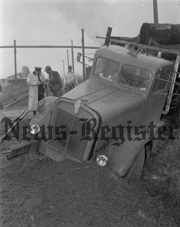 1955-3-25 Log truck Loses in Duel with train 2.jpeg
