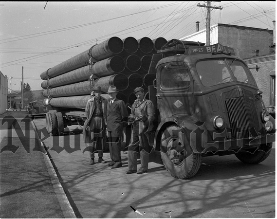 1946-3-28 City Water & Light. New Water Main 16 inch pipe (L to R, Bill Wilmont, M.H. Mcguire, Elmer Snodgrass).jpeg
