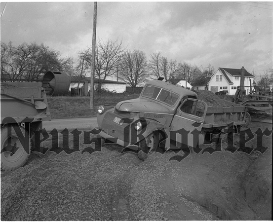 1950-2-3 County gravel truck mired in mud.jpeg