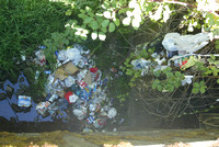 Trash dumped in river -TB